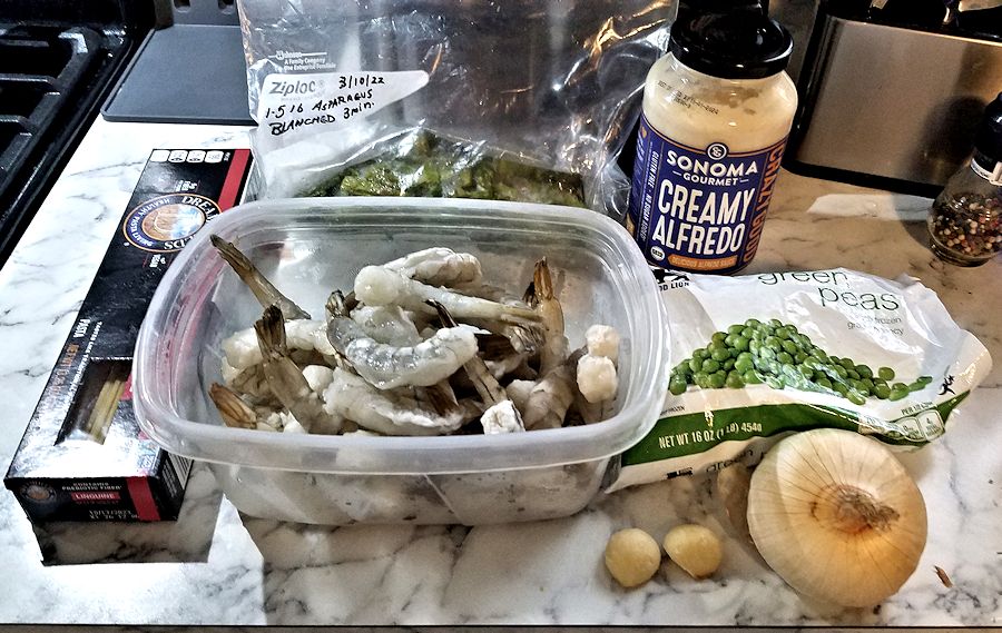 Getting Ready To Cook Creamy Pasta With Shrimp Asparagus Peas And getting-ready-to-cook-creamy-pasta-with-shrimp-asparagus-peas-and